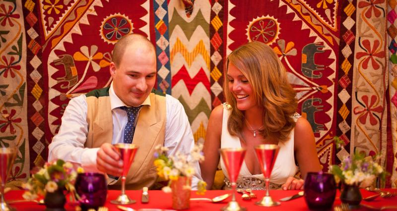 Bride and groom at low table 