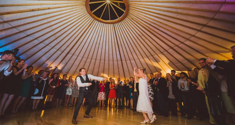 Dancing on wooden dance floor in yurt