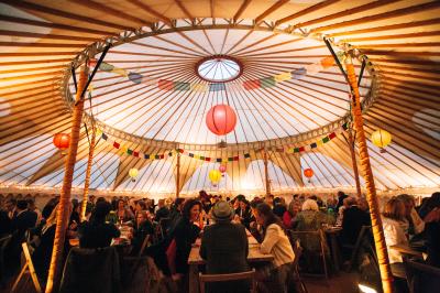 44ft yurt with uplighters and fairy lights