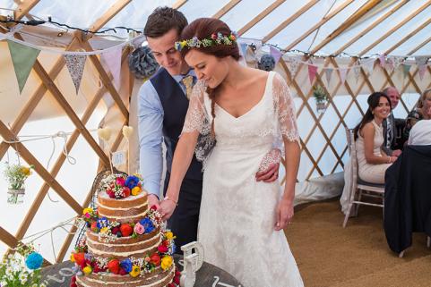 Bride and groom cut the cake