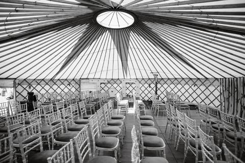 32ft yurt with simple decor and wedding seating
