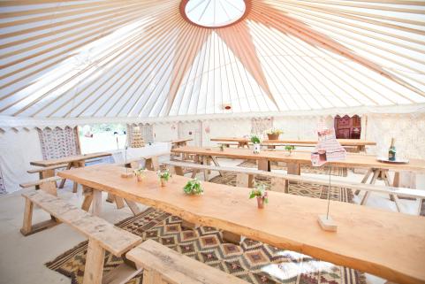 32ft yurt with stunning decor and rustic tables