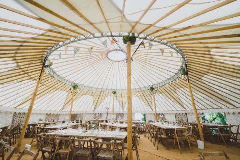 44ft yurt with stunning decor and rustic tables