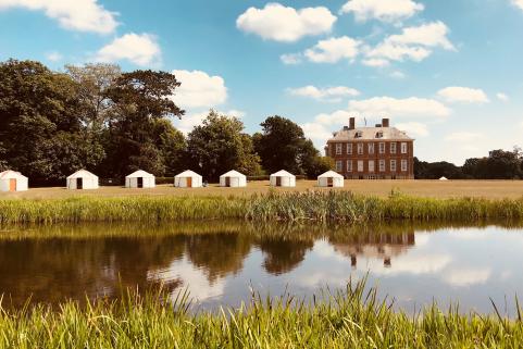 Yurts outside across water